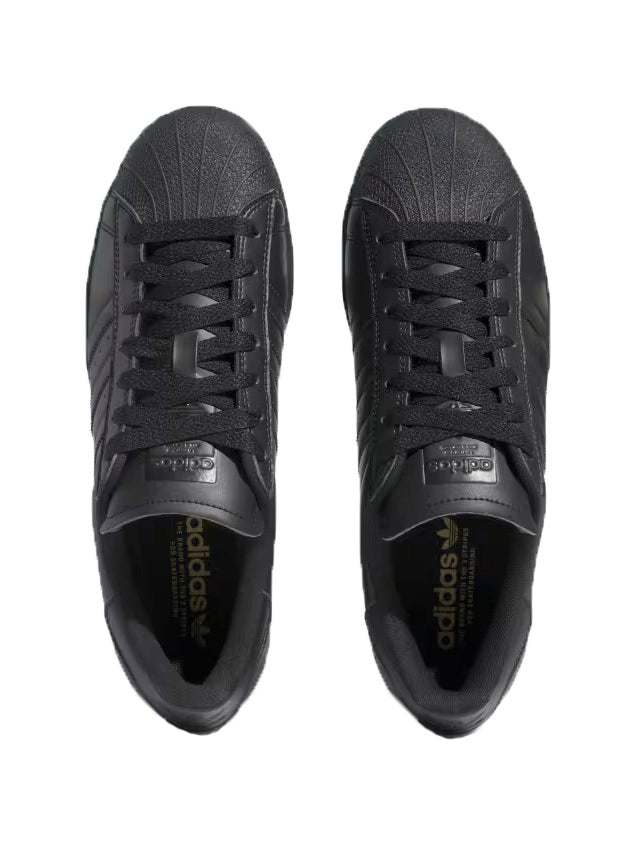 Adidas superstar black gold stripes best sale